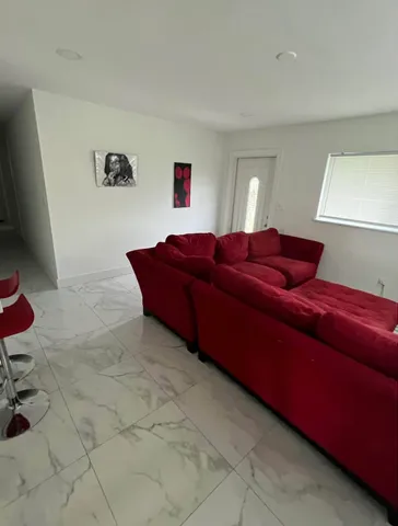 a living room with furniture and a couch