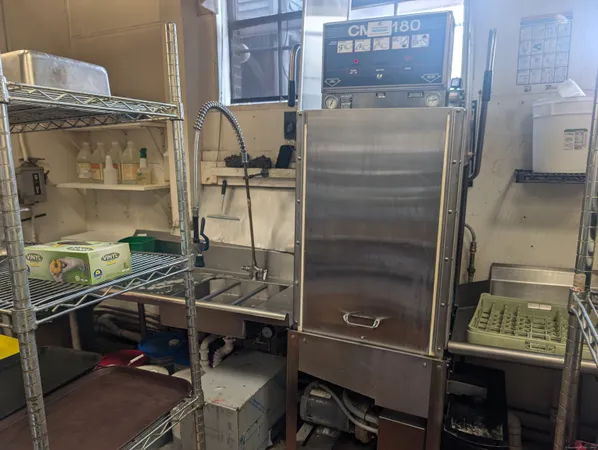 a kitchen with a stove and a refrigerator