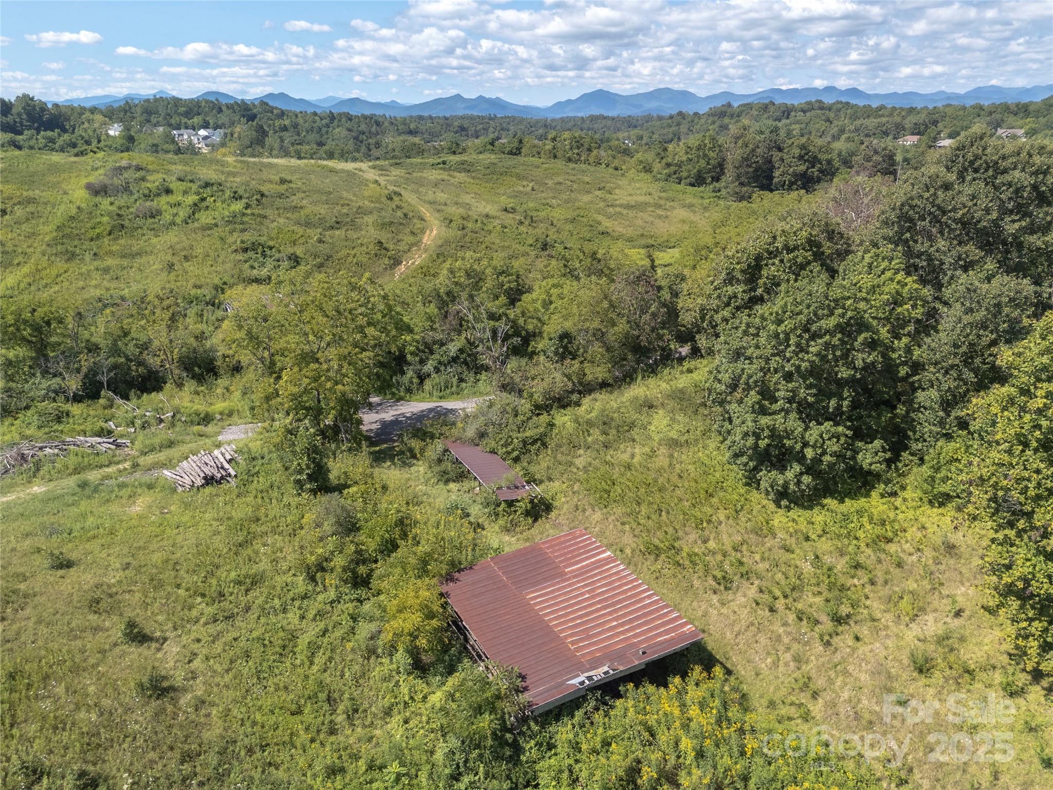 56 Gill Branch Road Weaverville, NC 28787 - Photo 11 of 47 a view of an outdoor space and a yard