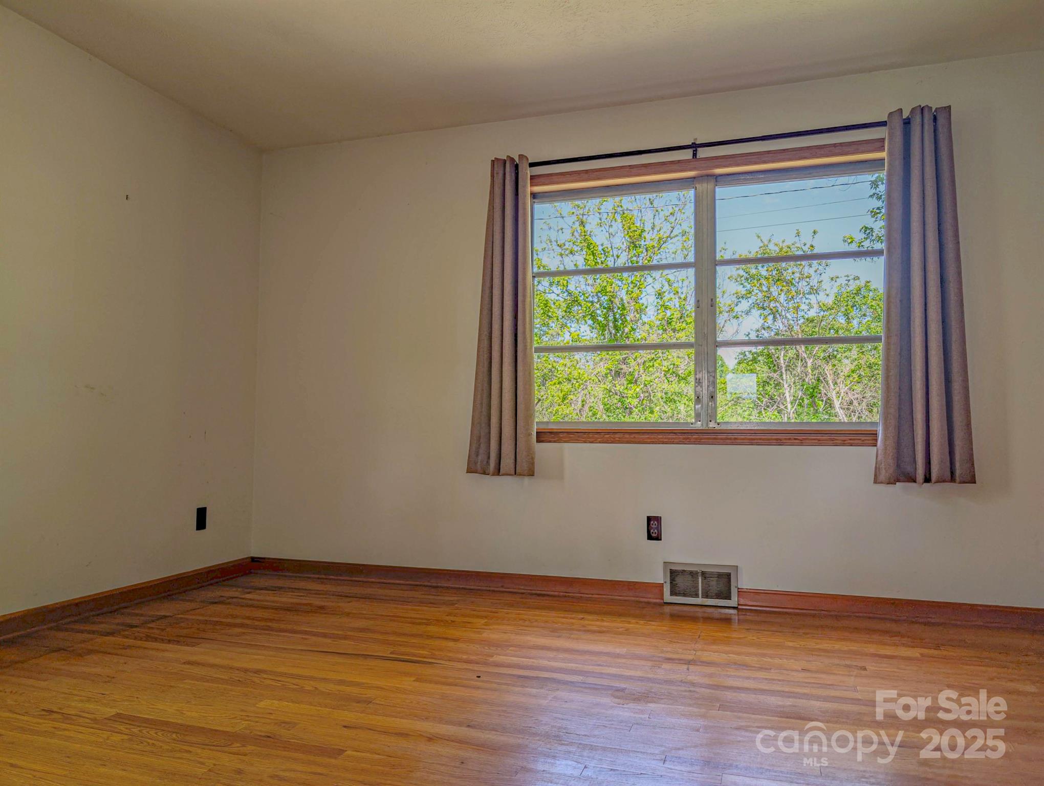 56 Gill Branch Road Weaverville, NC 28787 - Photo 21 of 47 a view of empty room with wooden floor and fan