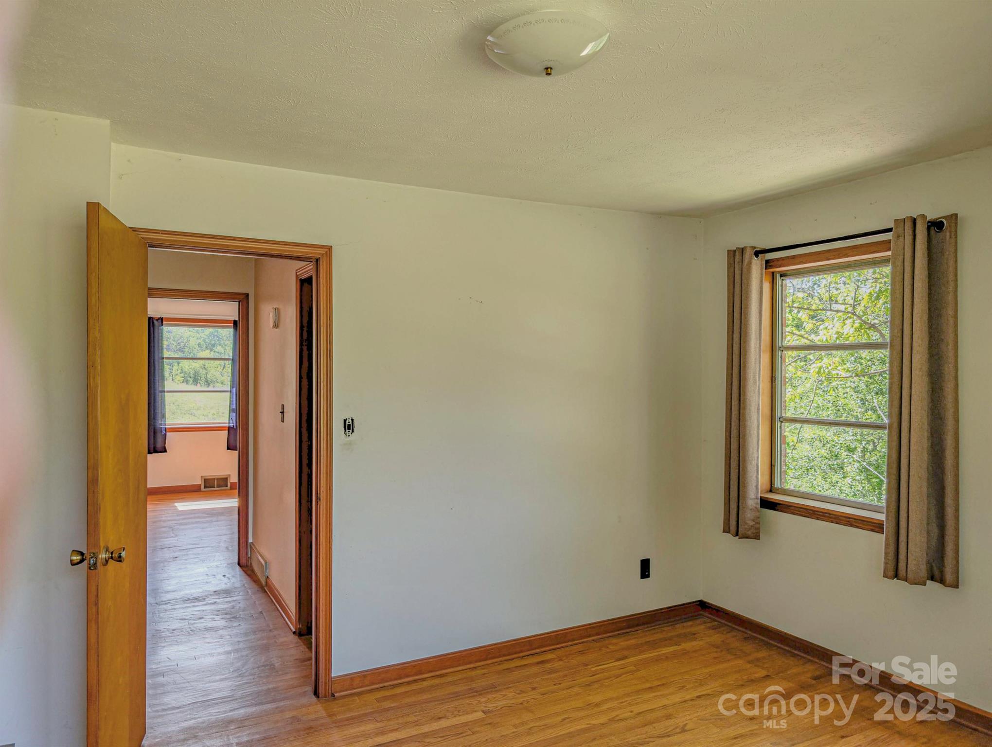 56 Gill Branch Road Weaverville, NC 28787 - Photo 23 of 47 a view of a room with wooden floor and a bathroom