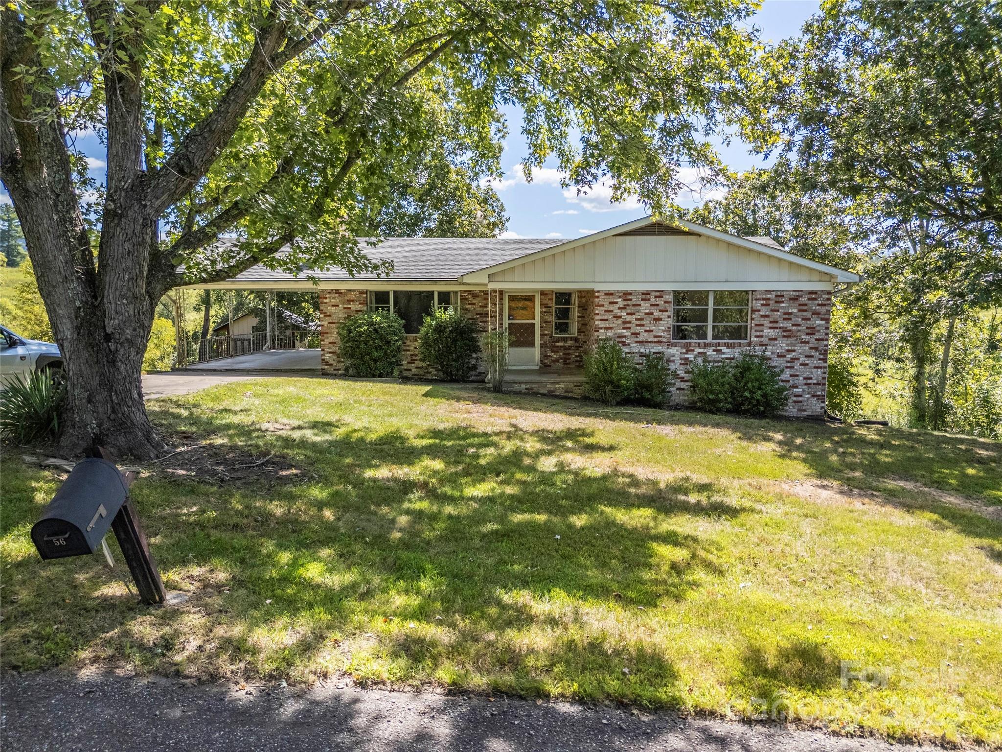 56 Gill Branch Road Weaverville, NC 28787 - Photo 42 of 47 a front view of a house with a yard
