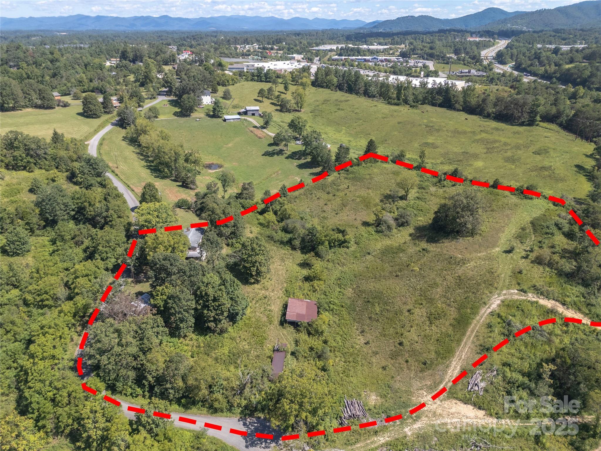 56 Gill Branch Road Weaverville, NC 28787 - Photo 7 of 47 an aerial view of a houses and city view
