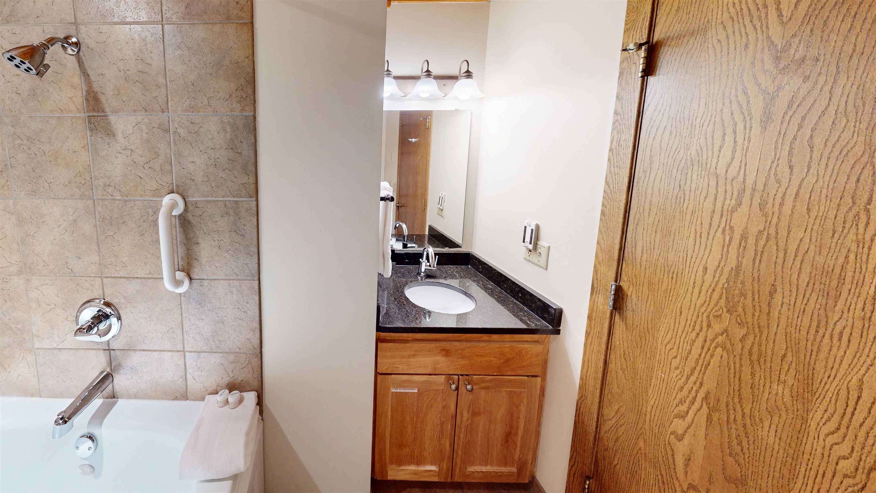 7192 Highway 61, Unit 37 Tofte, MN 55615 - Photo 12 of 15 Bathroom featuring vanity and bathing tub / shower combination