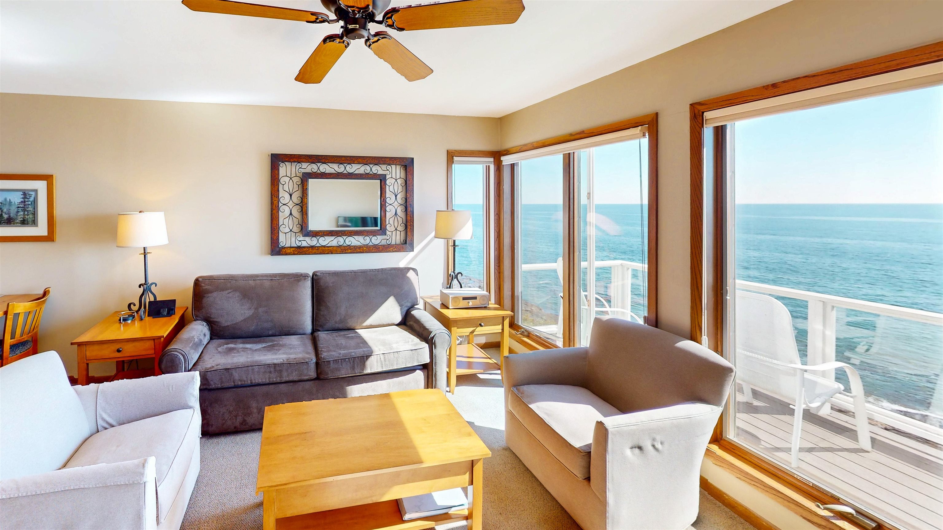 7192 Highway 61, Unit 37 Tofte, MN 55615 - Photo 5 of 15 Living room featuring a water view and ceiling fan