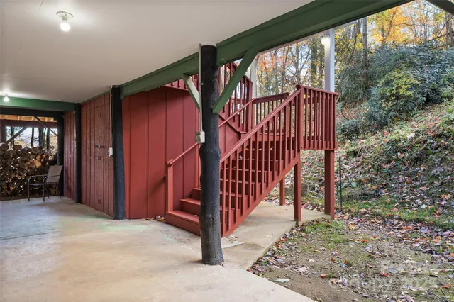 a view of room with furniture and a large window