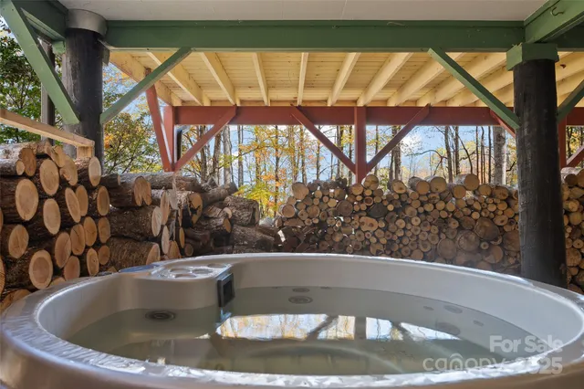 a view of storage and utility room with closet window