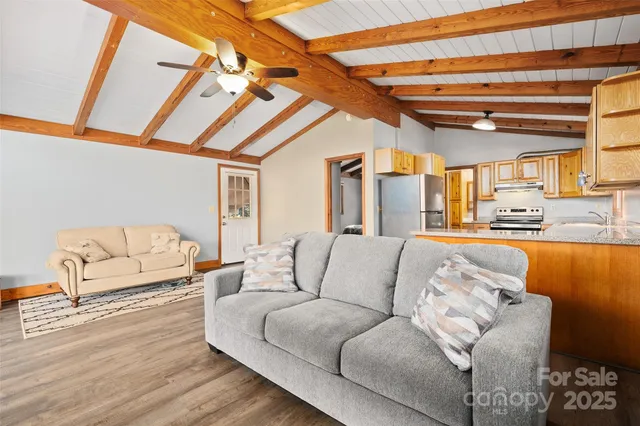 a bedroom with furniture and a large window