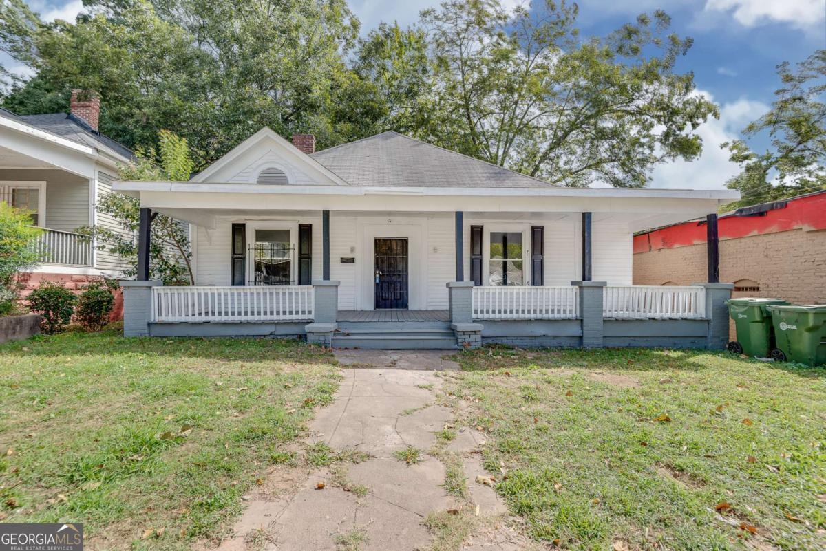1330 Allene Avenue Southwest Atlanta, GA 30310 - Photo 1 of 24 a view of a house with a big yard and potted plants