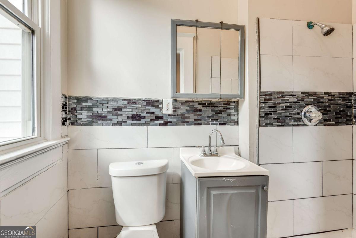 1330 Allene Avenue Southwest Atlanta, GA 30310 - Photo 14 of 24 a bathroom with a sink and a mirror