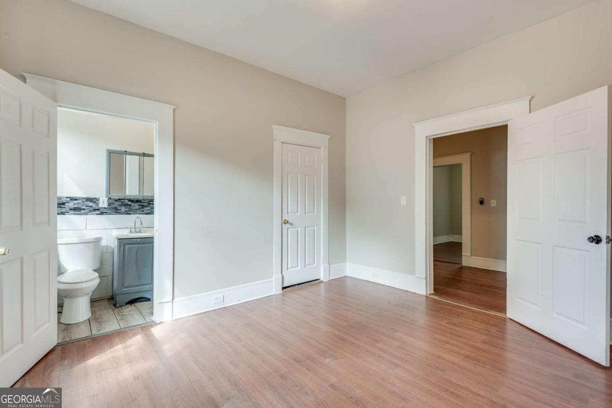 1330 Allene Avenue Southwest Atlanta, GA 30310 - Photo 15 of 24 a big room with wooden floor and bathroom view