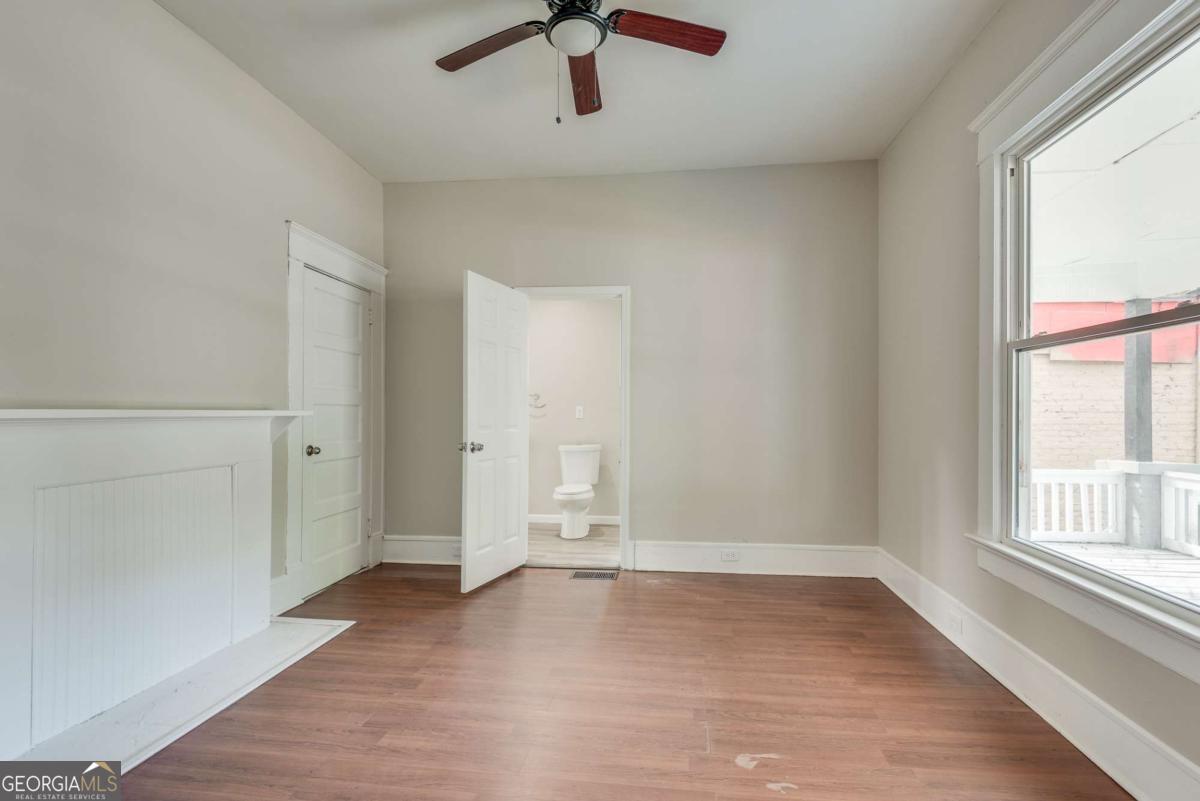 1330 Allene Avenue Southwest Atlanta, GA 30310 - Photo 17 of 24 wooden floor in an empty room with a window
