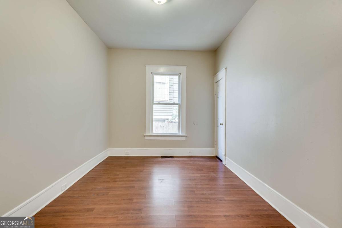 1330 Allene Avenue Southwest Atlanta, GA 30310 - Photo 18 of 24 wooden floor in an empty room with a window