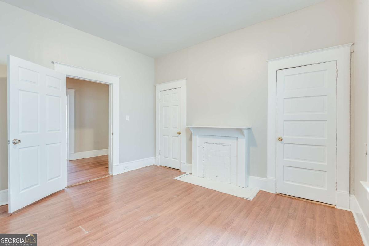 1330 Allene Avenue Southwest Atlanta, GA 30310 - Photo 19 of 24 an empty room with wooden floor & closet area