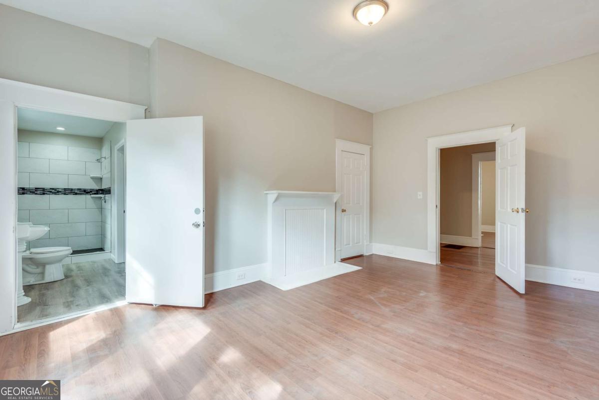1330 Allene Avenue Southwest Atlanta, GA 30310 - Photo 22 of 24 a view of a big room with wooden floor and a bathroom