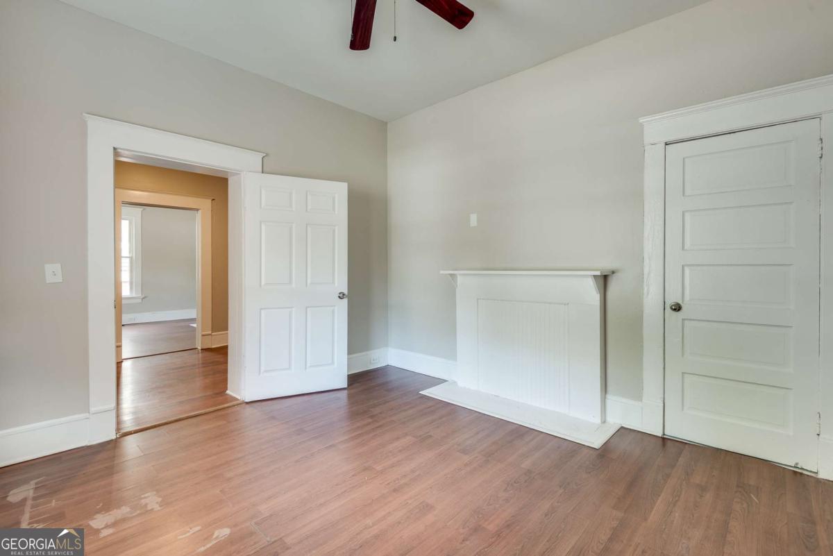 1330 Allene Avenue Southwest Atlanta, GA 30310 - Photo 24 of 24 an empty room with wooden floor and closet