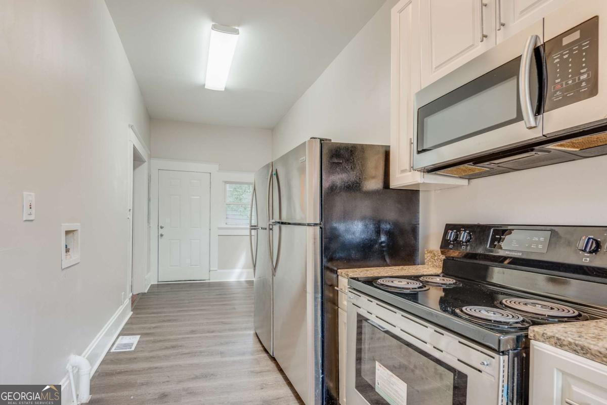 1330 Allene Avenue Southwest Atlanta, GA 30310 - Photo 8 of 24 a kitchen with a stove and a microwave