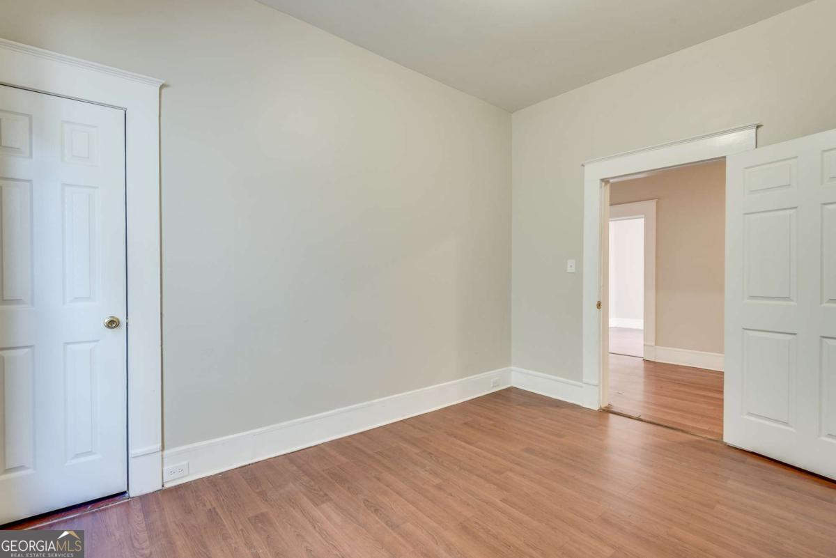 1330 Allene Avenue Southwest Atlanta, GA 30310 - Photo 9 of 24 a view of an empty room with wooden floor