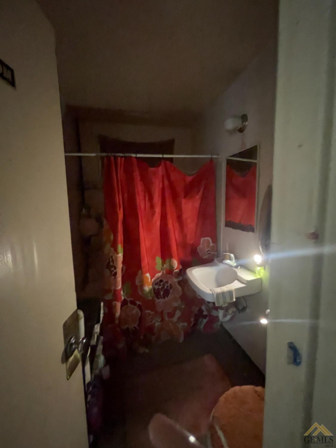 Undisclosed Address Bakersfield, CA 93304 - Photo 12 of 14 a bathroom with a sink and a mirror
