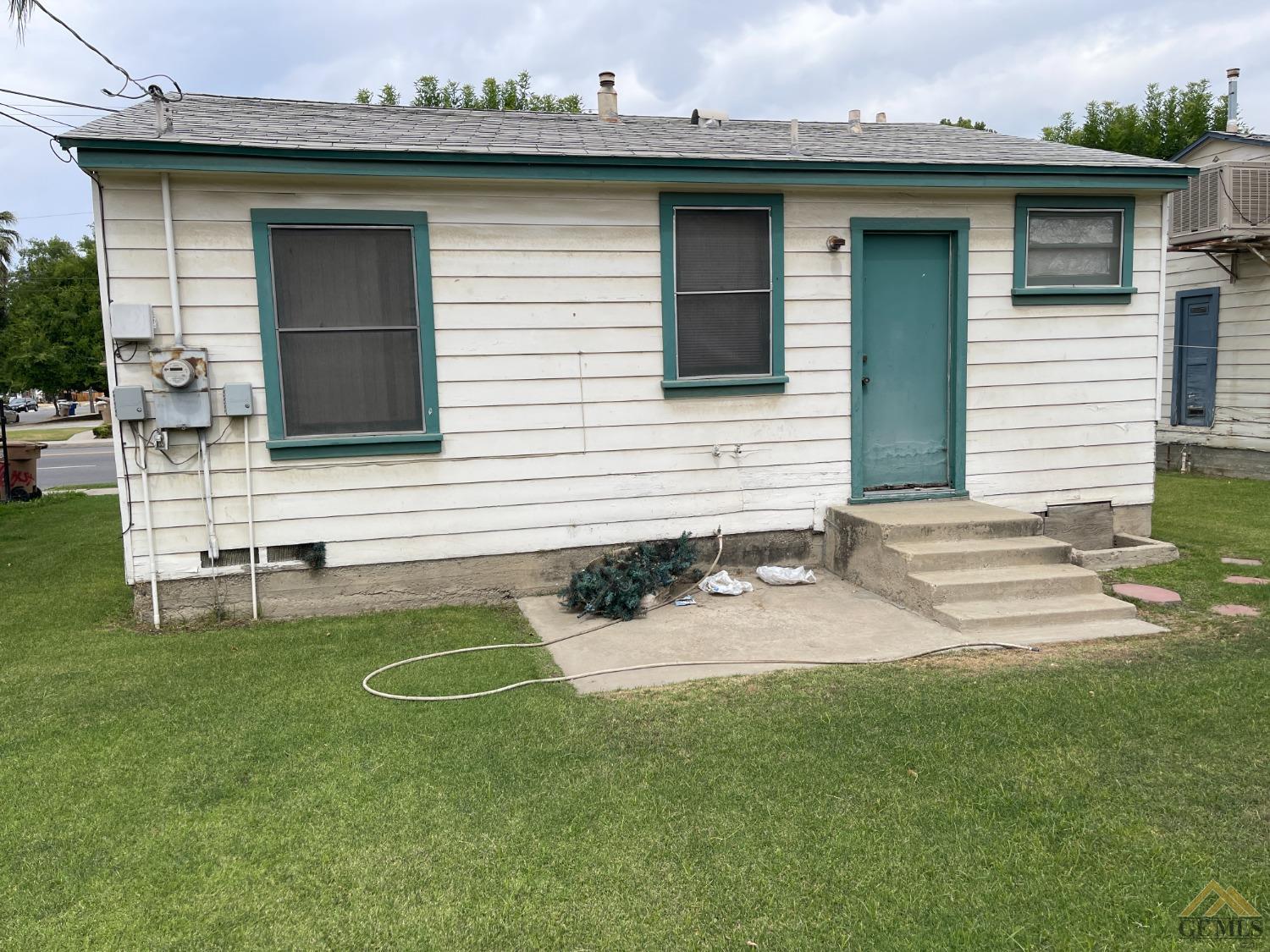 Undisclosed Address Bakersfield, CA 93304 - Photo 3 of 14 a view of a house with a backyard