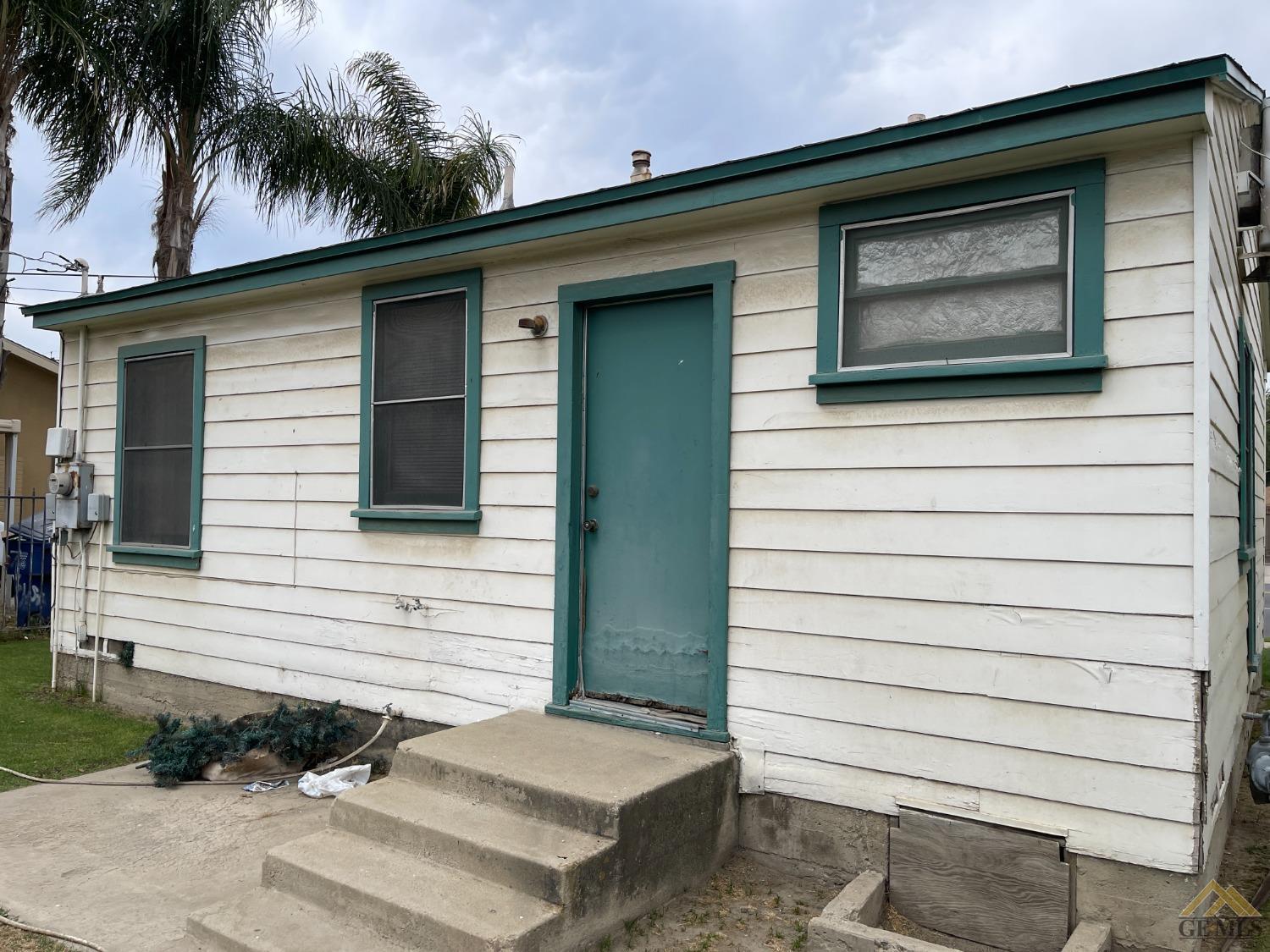 Undisclosed Address Bakersfield, CA 93304 - Photo 4 of 14 a view of front door and potted plants