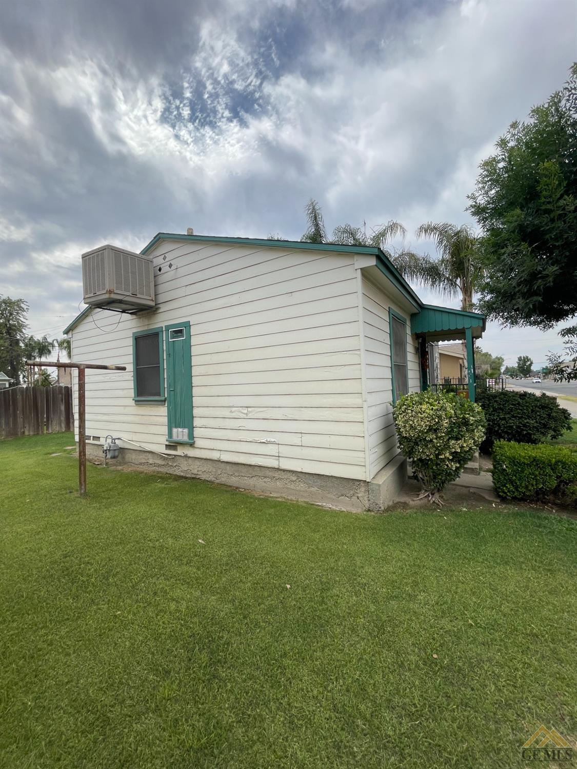 Undisclosed Address Bakersfield, CA 93304 - Photo 5 of 14 a view of a backyard with plants and a garden