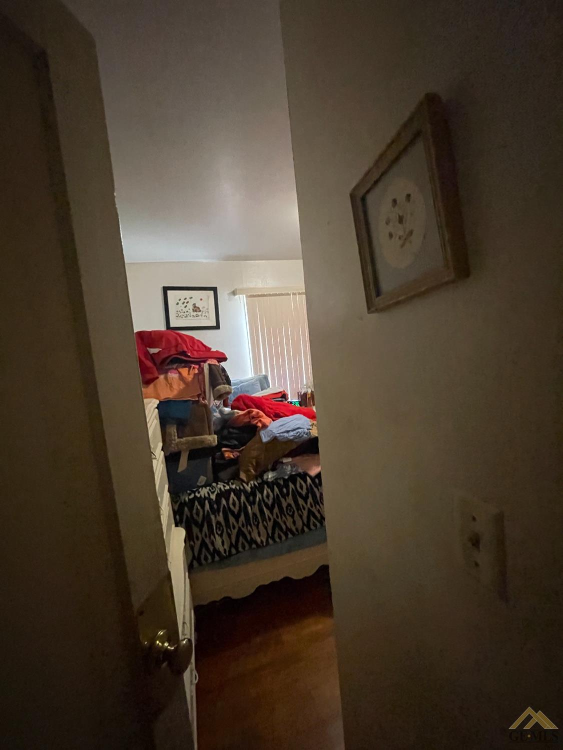Undisclosed Address Bakersfield, CA 93304 - Photo 10 of 14 a bed room with a bed and a baby