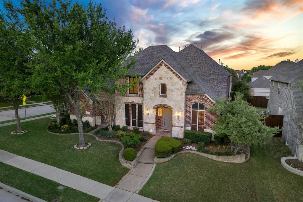 701 Mason Drive Allen, TX 75013 - Photo 1 of 1 a front view of a house with garden