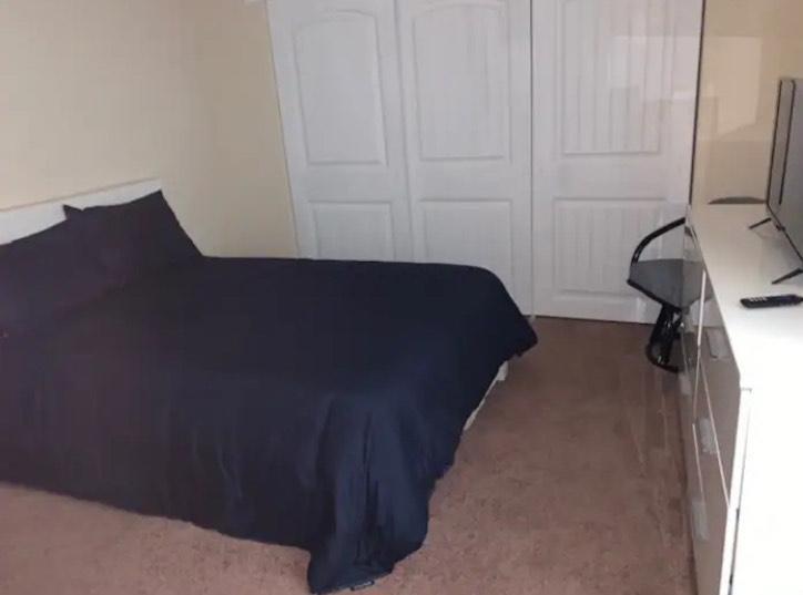 19418 Ferretti Road Groveland, CA 95321 - Photo 13 of 35 a bedroom with a bed and a chair