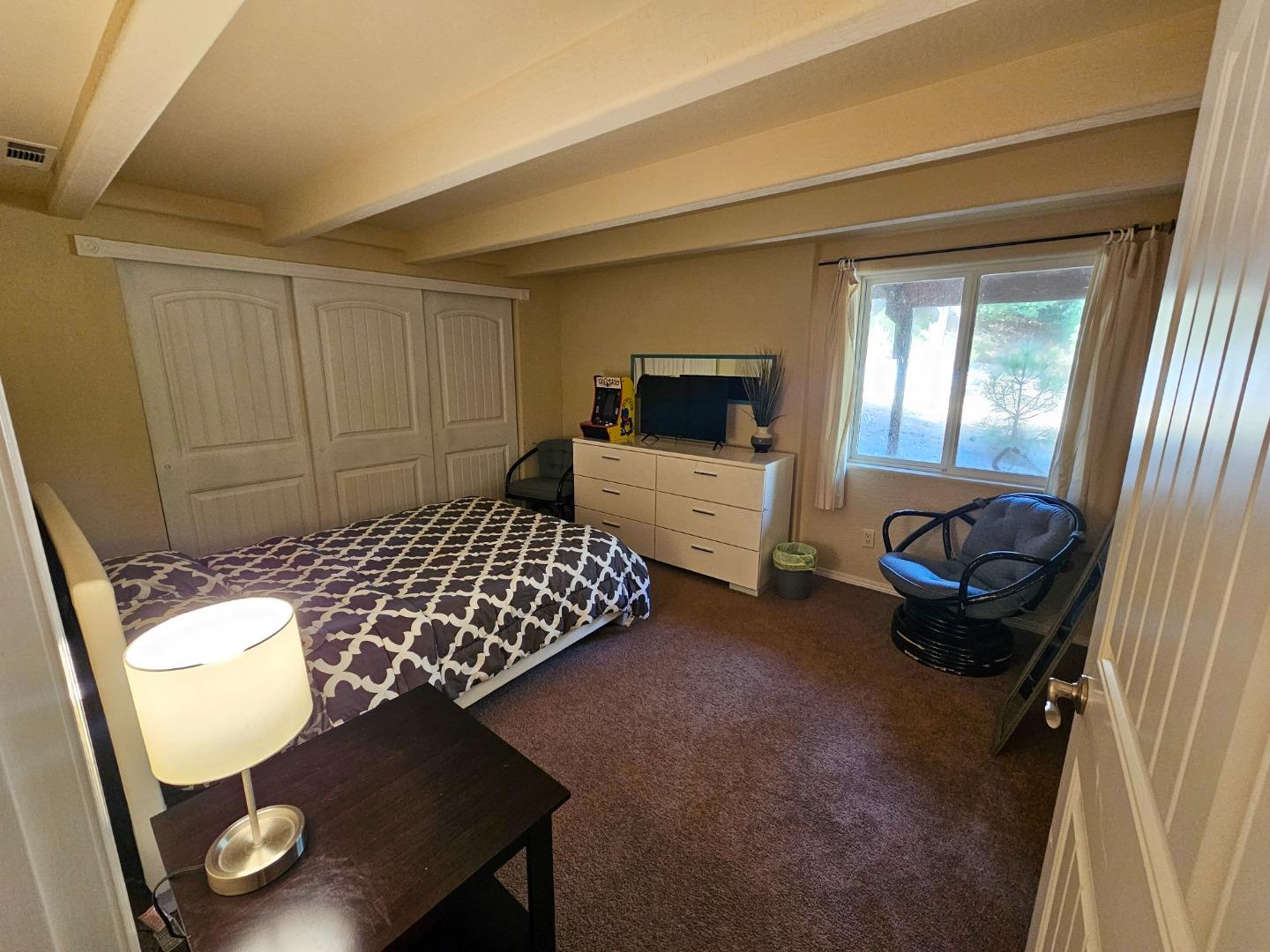 19418 Ferretti Road Groveland, CA 95321 - Photo 14 of 35 a bedroom with furniture and a window