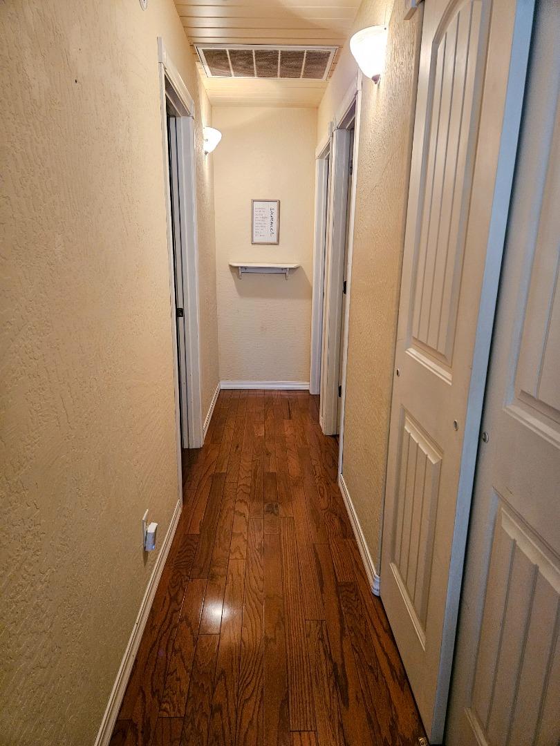 19418 Ferretti Road Groveland, CA 95321 - Photo 21 of 35 a view of a hallway with wooden floor