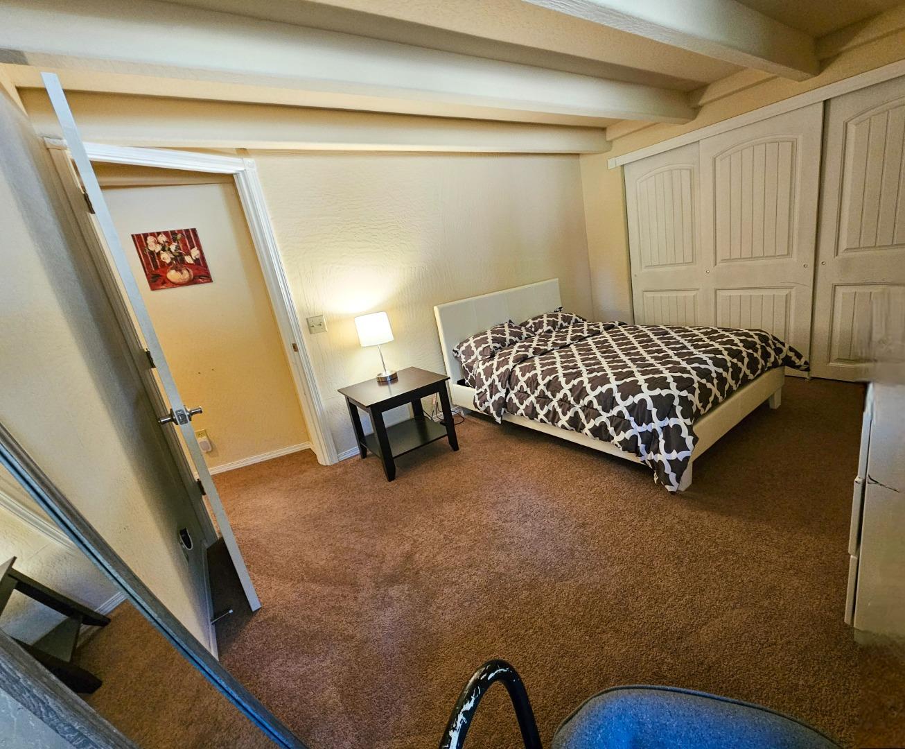 19418 Ferretti Road Groveland, CA 95321 - Photo 23 of 35 a bed sitting in a bedroom next to a window