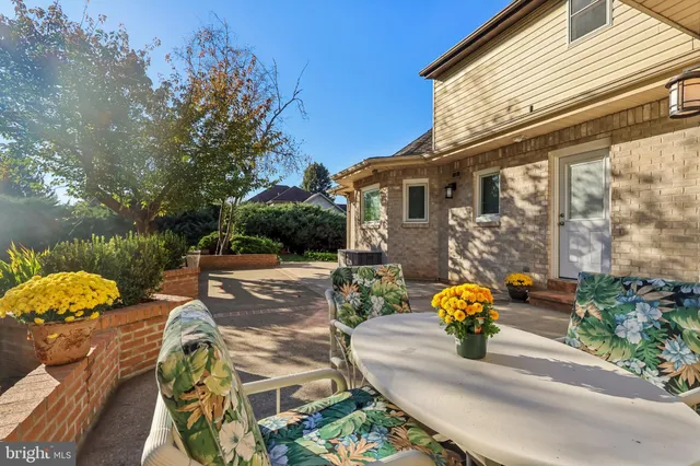a view of a backyard with sitting area