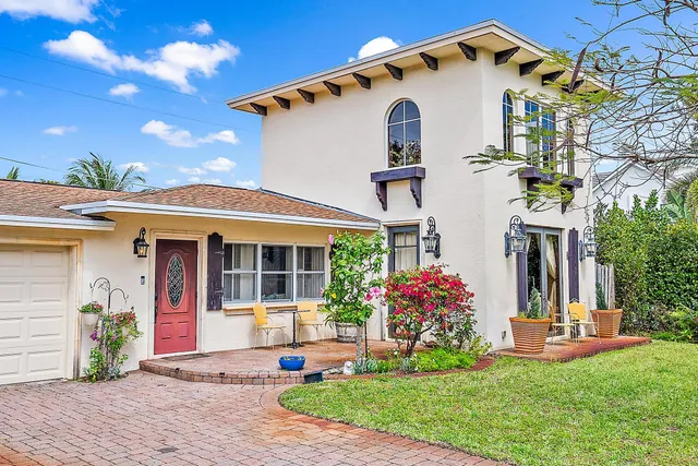 a front view of a house with yard