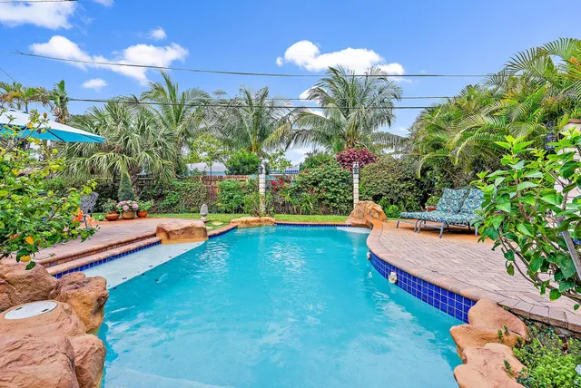 a backyard of a house with outdoor seating