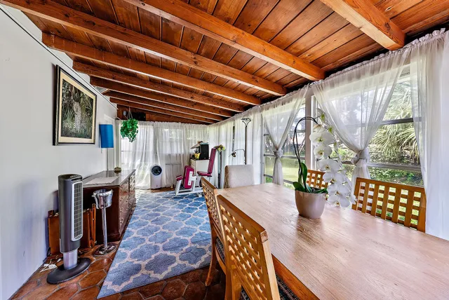 a view of an chairs and table in the patio