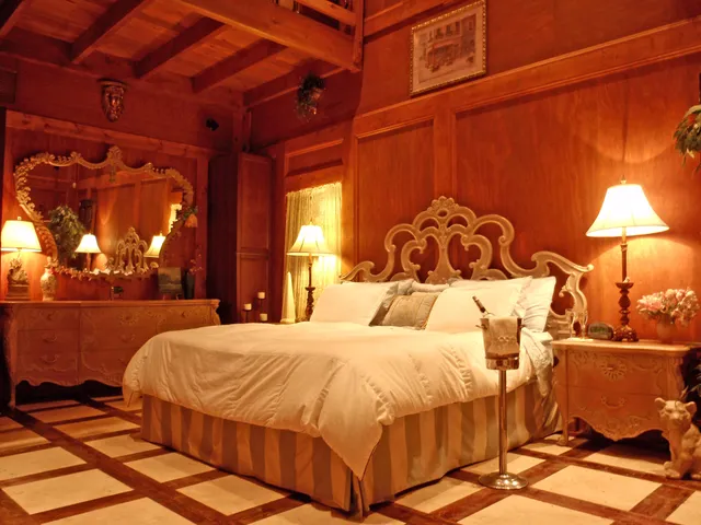 a bedroom with a bed and a lamp