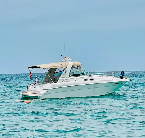 a bathroom with a sink mirror and toilet