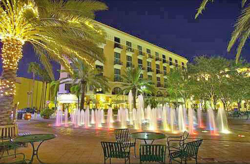 245 Arlington Road West Palm Beach, FL 33405 - Photo 37 of 40 a view of a patio with table and chairs and potted plants