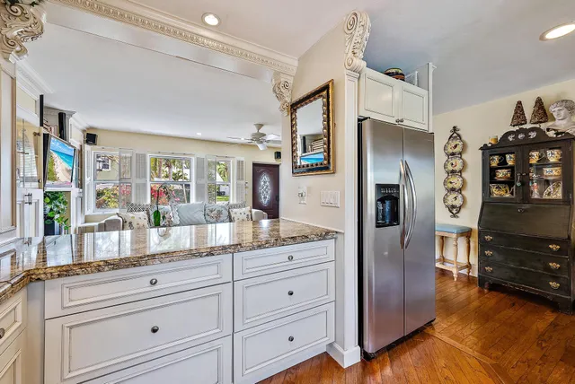 a kitchen with granite countertop cabinets and stainless steel appliances