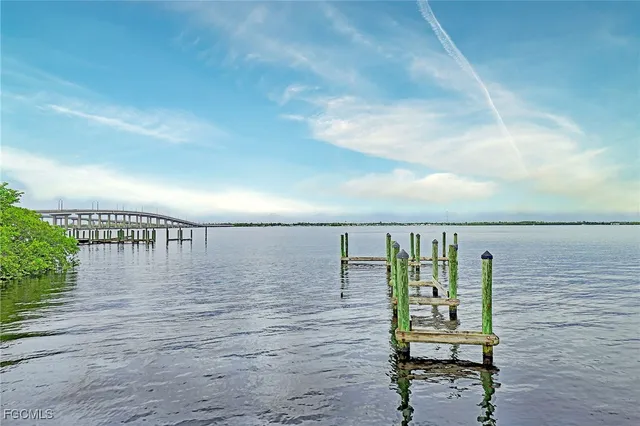 a view of a swimming pool with outdoor seating