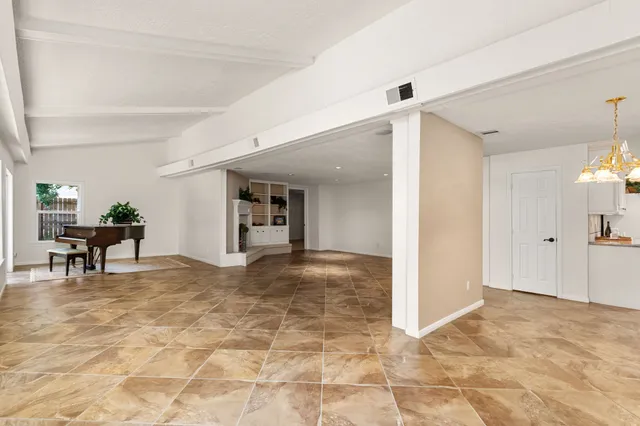 a view of a livingroom with furniture and an entryway