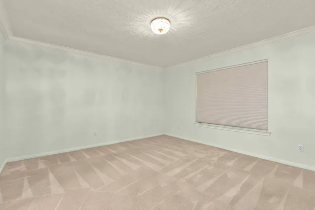 an empty room with a fan