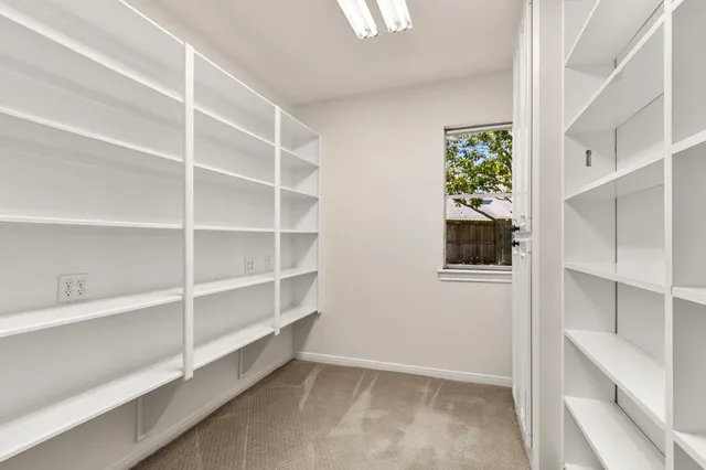 a view of an empty walk in closet