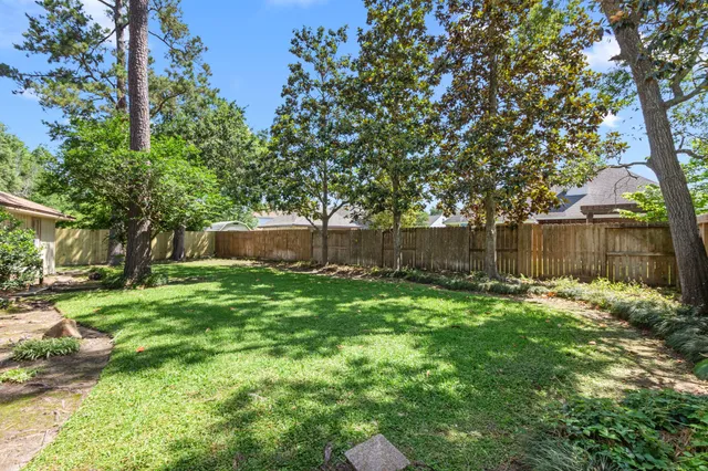 a garden with wooden fence