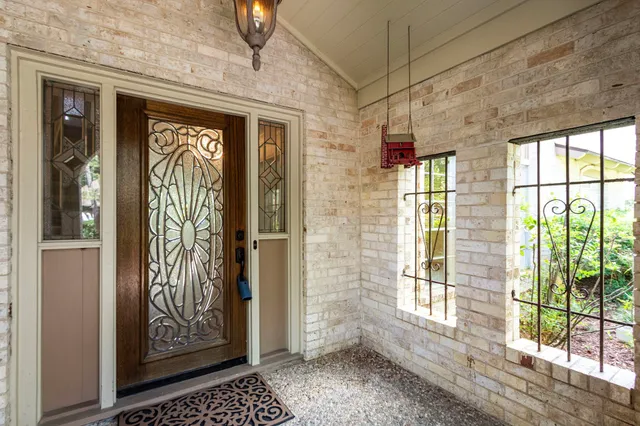 a view of an entryway door with wooden floor