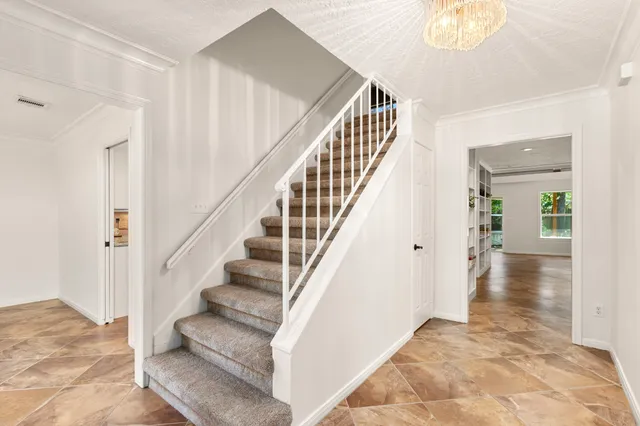 a view of staircase with white walls and white walls