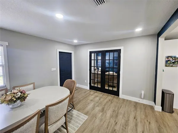a view of a livingroom with furniture and wooden floor