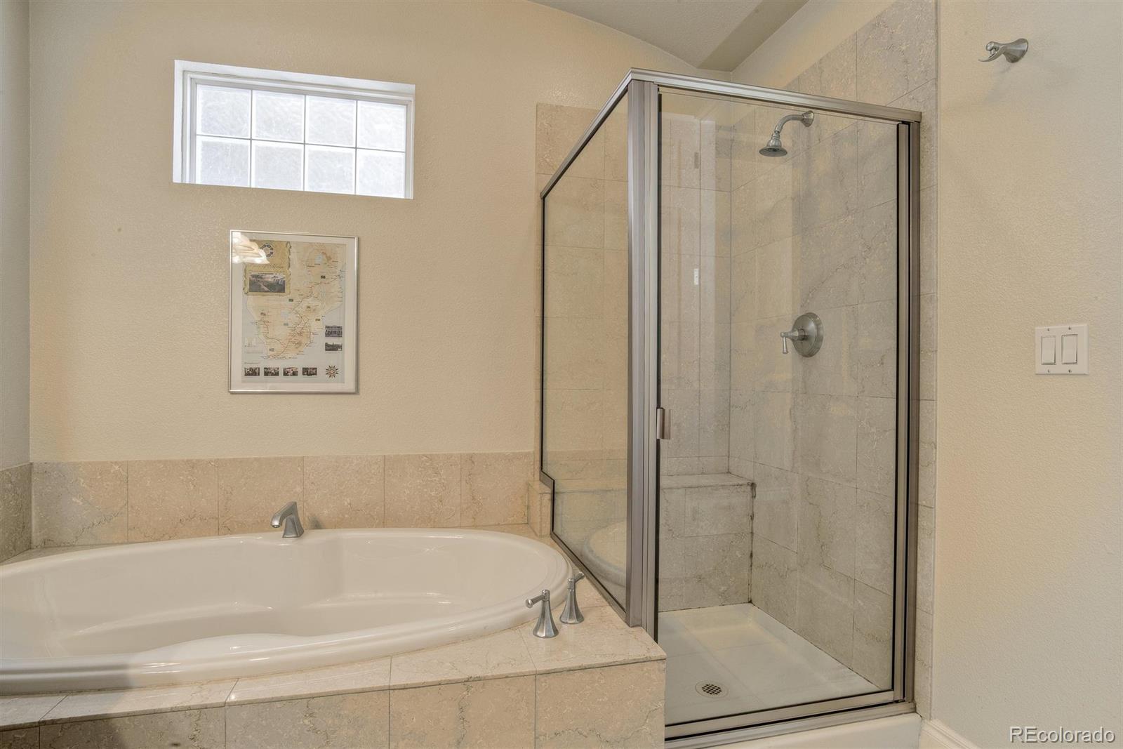 40 Madison Street, Unit 208 Denver, CO 80206 - Photo 16 of 20 a bathroom with a bathtub and a shower