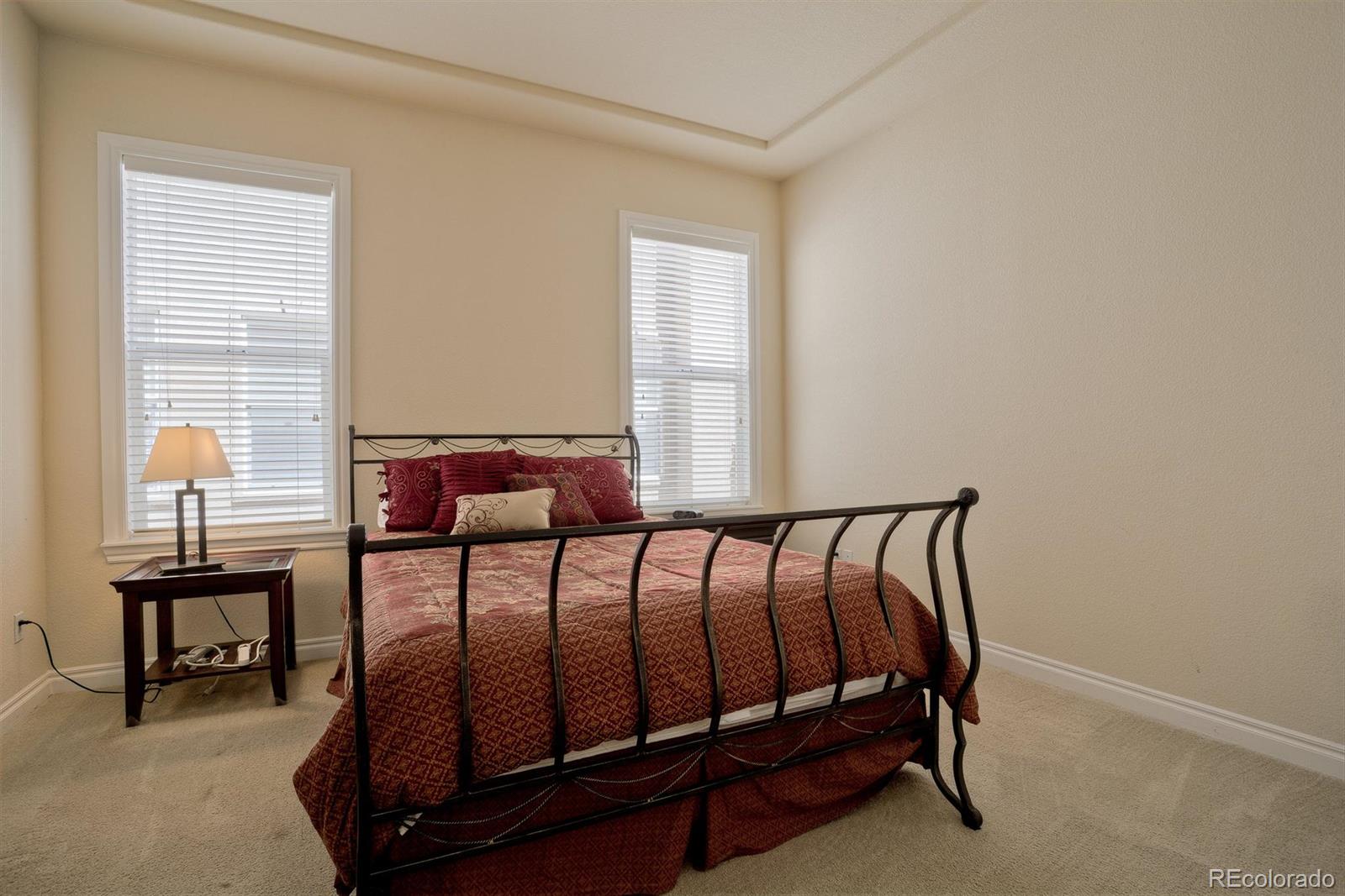 40 Madison Street, Unit 208 Denver, CO 80206 - Photo 17 of 20 a bedroom with a bed and a window